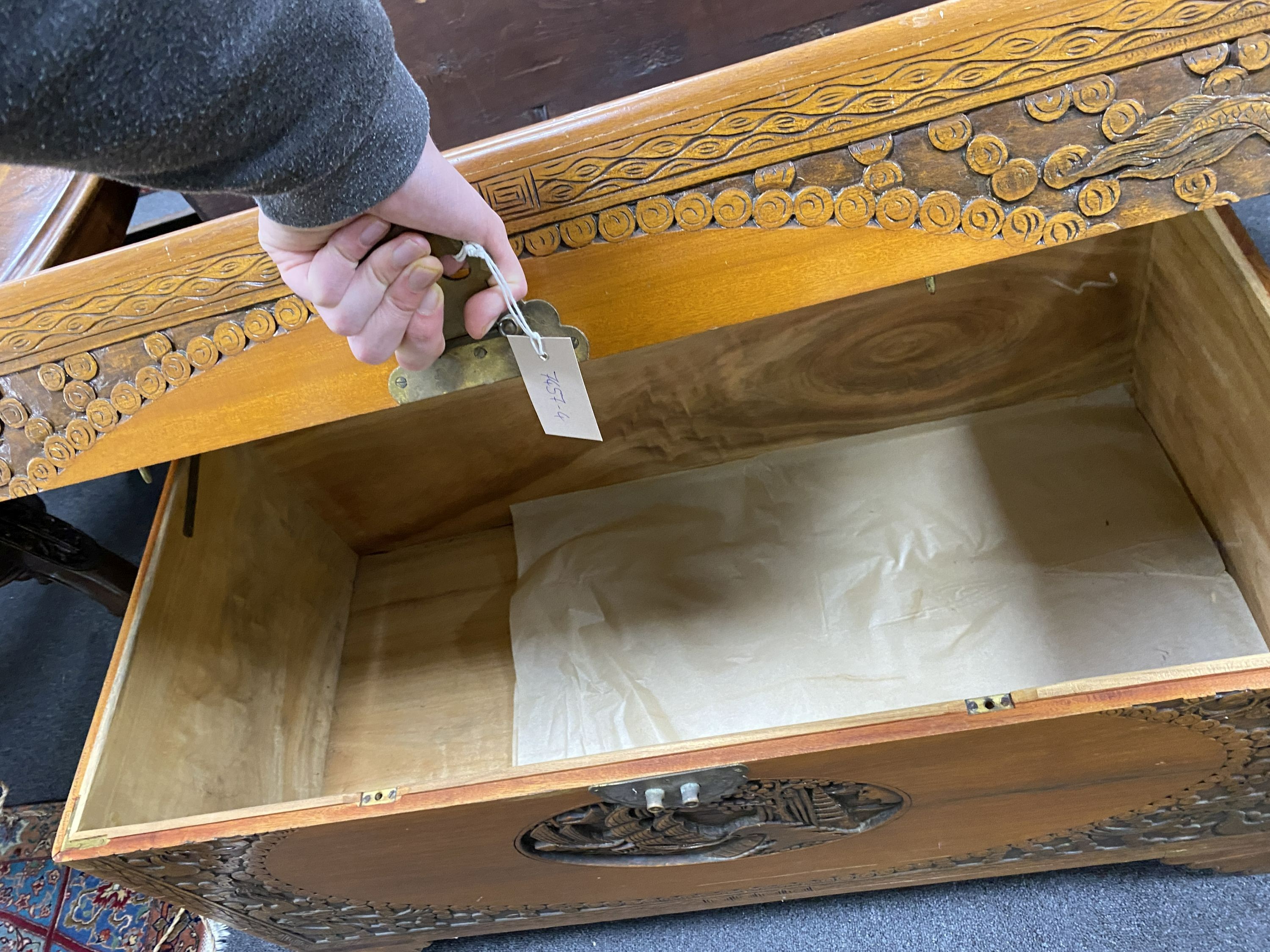 A Chinese carved camphorwood chest, length 104cm, depth 51cm, height 60cm